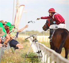 ... and sharing her joy with racegoers