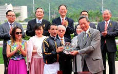 Dr Simon Ip, Chairman of The Hong Kong Jockey Club, with winning jockey Joao Moreira at the presentation ceremony