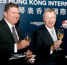 HKJC’s Chief Executive Officer Winfried Engelbrecht-Bresges (right) and Executive Director of Racing William A Nader (left) toast and celebrate the success of the LONGINES Hong Kong International Races.