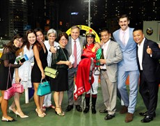 Trainer Caspar Fownes and jockey Olivier Doleuze celebrate with connections after the win of Jumbo Happiness.