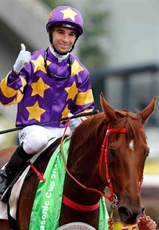 Joao Moreira gives a thumbs up as he returns aboard Panasonic Cup winner Western Express.