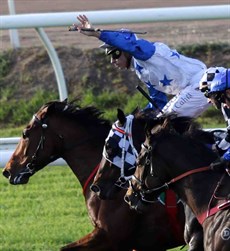 Michael Cahill signals victory as the Tony Pike trained The Bostonian makes it back to back Group 1 wins by taking out the Kingsfird-Smith