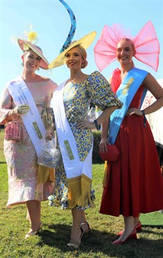 Tatianna Hoffmann won the Darwin Cup Fashions on the Field competition dressed in a yellow and blue leopard print dress and peacock millinery head piece.