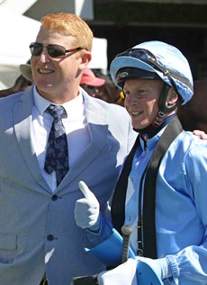 Trainer Tom Button and Nick Keal celebrate their win with The Tax Accountant in the first ever Country Highway race in Queensland at Doomben on Saturday.