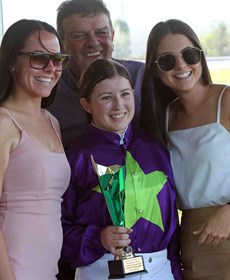 Accepting the trophy that came with the Gatton win 