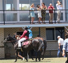 A moment in time as Zac Lloyd goes out for his first ride in a race aboard Satine watched by his family ...