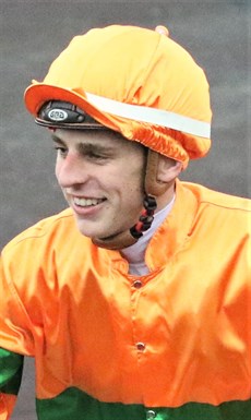 Baylee Nothdurft ... back in the winner's enclosure on a major racing day after guiding Shooting For Gold to victory at Eagle Farm (below)