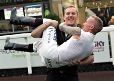 Byrne has had his good times ... such as sharing this moment with his son Corey after winning the Group 1 Doomben 10 000 on Redzel 