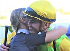 Stephanie and Ben Thompson share a special embrace after a very special win