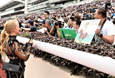 Nicole Purton (above) and Lucky Sweynesse's owner (below) were just two of a steady flow of people to stop by to show Vieri their appreciation of the very special presence he brings to race meetings in Hong Kong 