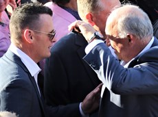 There is always room for sportsmanship in this game ... Rob Heathcote congratulates Think About It's trainer Joe Pride on his win in the Stradbroke.

Photos: Graham Potter