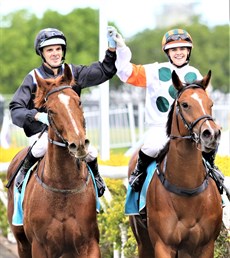 A magical moment at the Gold Coast as Noel Callow raises the hand of his daughter Stacey after her win in the fifth race on Saturday's card (above and below)